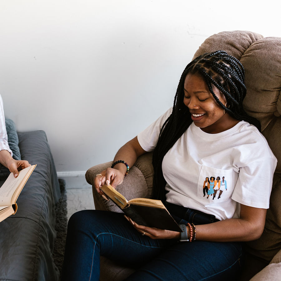College students enthusiastically playing Ultimate Frisbee on a sunny day